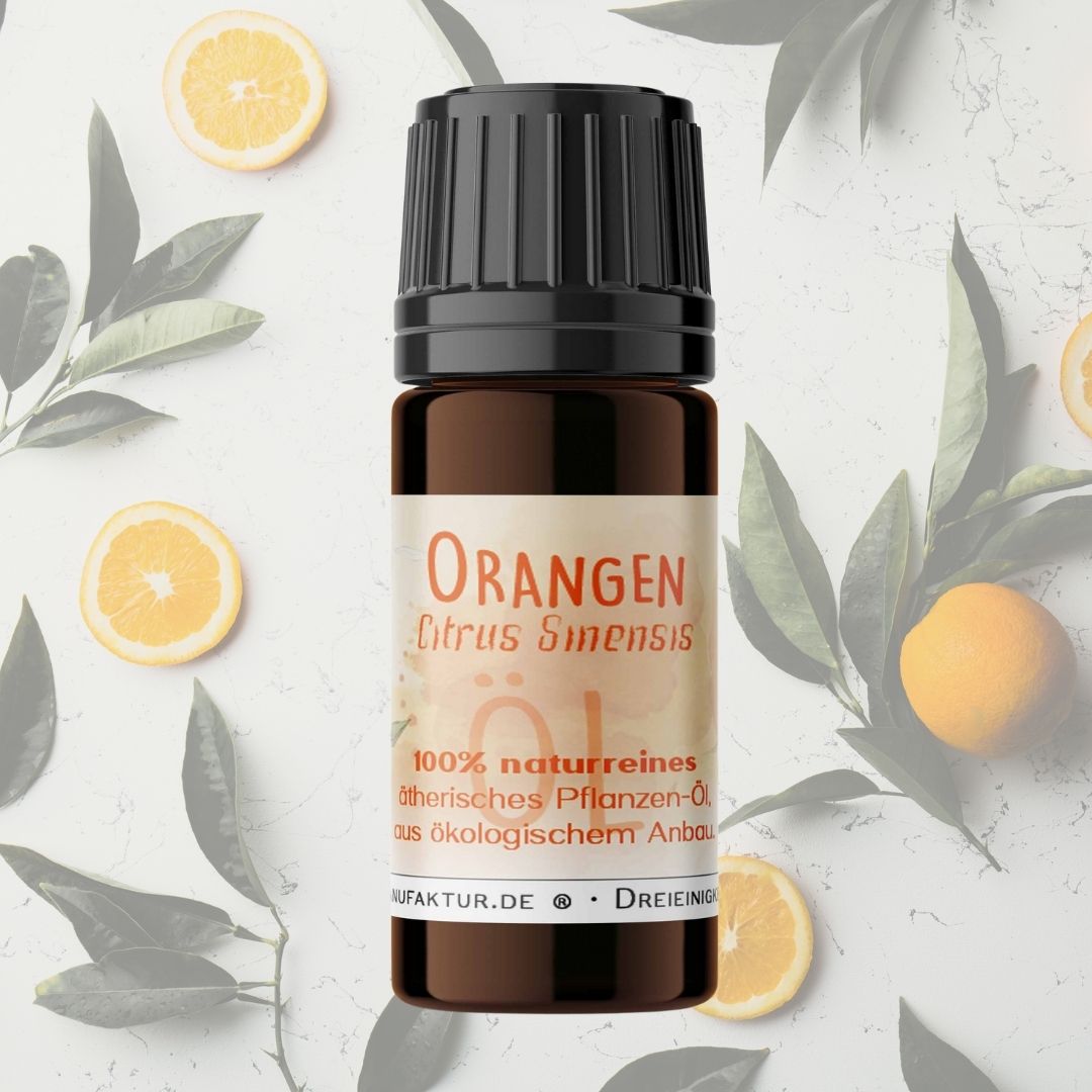 Orange ätherisches Öl neben frischen Orangenscheiben